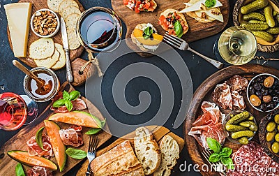 Italian wine antipasti snack variety over dark background Stock Photo