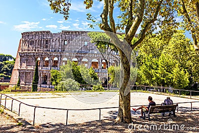Italians rest on the playground in front of the Coliseum Editorial Stock Photo