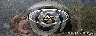 Italy, Ambruzzo - August 28, 2021 - Ford company logo on a car illuminated at night. Editorial Stock Photo