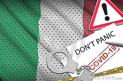 Italy flag and police handcuffs with inscription Don`t panic on white paper. Coronavirus or 2019-nCov virus concept Stock Photo