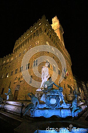 Italy,Florence, Palazzo Vecchio and Neptune fountain at nigt. Editorial Stock Photo