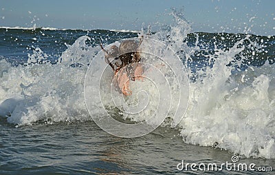 Girl in the sea, big wave, spray, swimming, joy, Stock Photo