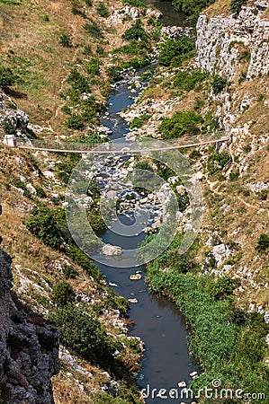 Italy. Matera. Canyon of the Gravina river. The tibetan bridge Stock Photo