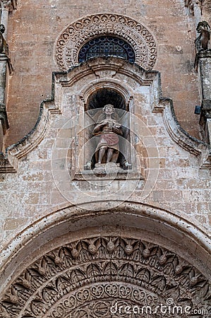 Italy. Matera. Church of St John the Baptist, 13th century. Detail. Polychrome stone statue of St. John the Baptist Editorial Stock Photo