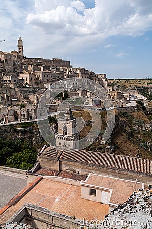 Italy. Matera. Panoramic view from Monterrone hill with the Church of San Pietro Caveoso, 13th century, and Sasso Caveoso Editorial Stock Photo