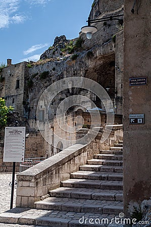 Italy. Matera. Touristic itinerary between the ancient Rioni Sassi. Glimpse of a scenic stairway inside the Sasso Caveoso Editorial Stock Photo