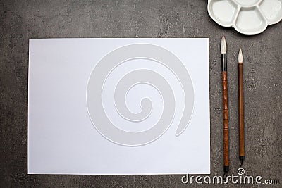 Items for drawing sumi-e, rice paper, Chinese brushes, ceramic p Stock Photo