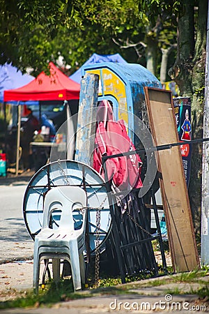 Items next to public telephones Editorial Stock Photo