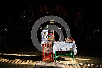 Items for sacrament of wedding on table and ambo. Stock Photo