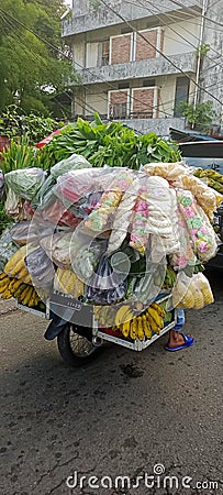 itinerant greengrocer brings with it a motorbike, practical, creative. Stock Photo