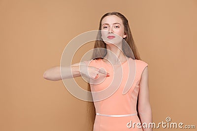 Its me. proud woman pointing herself. Stock Photo