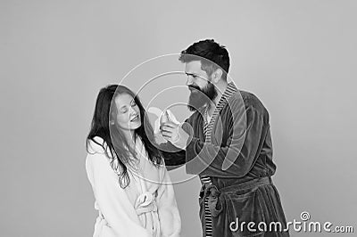Its not going to suck itself. Bearded man feed sexy woman with banana. Love games. Couple in love blue background. Love Stock Photo
