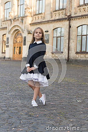 Its pleasure of elegance. Cute kid wear uniform outdoors. Back to school fashion. Fashion look of small girl. School Stock Photo