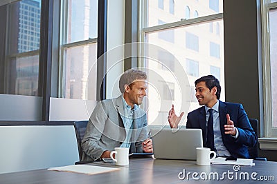 Its a positive meeting. businessmen working in their office. Stock Photo