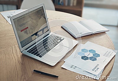 Its vital to always have a plan. Still life shot of a laptop and paperwork on a table in an office. Editorial Stock Photo