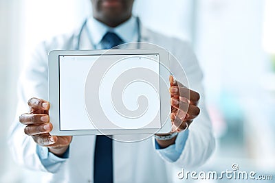 Its what the doctor recommends. Closeup shot of an unrecognizable doctor holding a digital tablet with a blank screen. Stock Photo