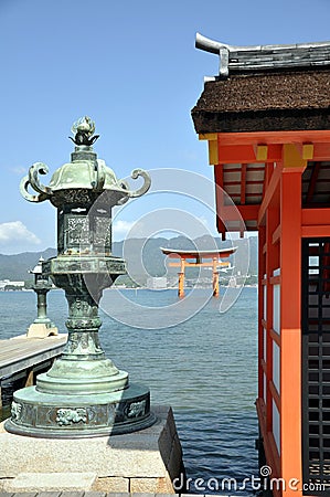 Itsukushima shrine, the Great torii in the background - Miyajima island Japan Stock Photo