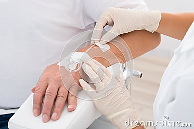 Iv Drip Inserted In Patient`s Hand Stock Photo