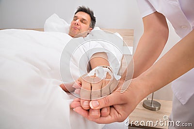 Iv drip in patient's hand Stock Photo