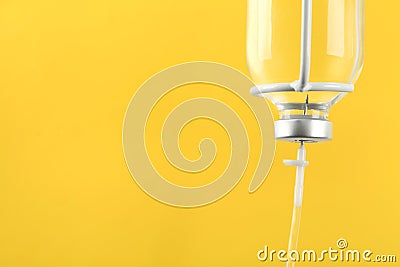 IV infusion set on yellow background, closeup. Space for text Stock Photo