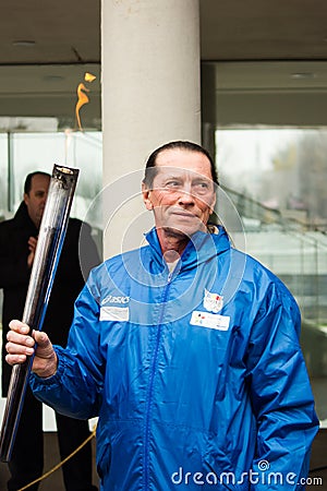 Ivan Patzaichin lighting the olympic torch Editorial Stock Photo