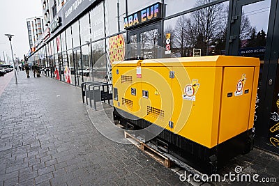 Ivano-Frankivsk, Ukraine - March, 2023: Yellow diesel generator on street Editorial Stock Photo