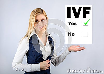 IVF. A woman holds a questionnaire where they chose in vitro fertilization Stock Photo