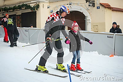 Ivica Kostelic teaching girl to ski Editorial Stock Photo