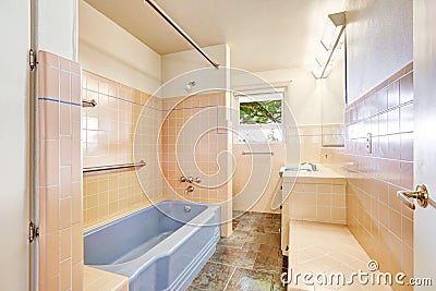 Ivory bathroom with blue bath tub Stock Photo
