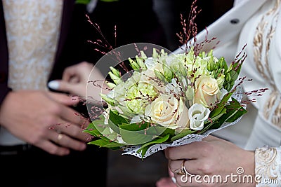 Ivory and green wedding bouquet of roses and carnation flowers Stock Photo