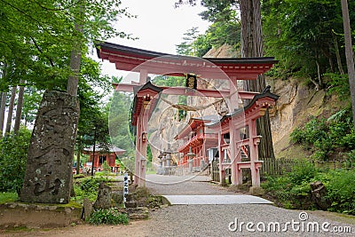 Torii at Takkoku-no-Iwaya Bisyamondo Hall in Hiraizumi, Iwate, Japan. The temple was founded by Stock Photo