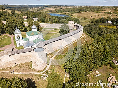 Izborsk medieval Russian fortress kremlin with a church. Aerial drone photo. Near Pskov, Russia. Birds eye view Stock Photo