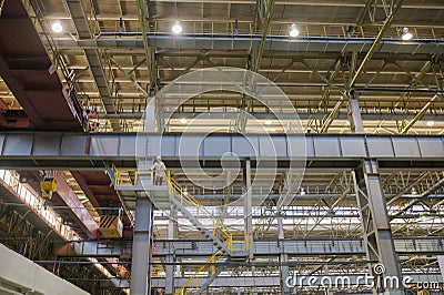 Izhevsk, Russia - December 14 2019: Automobile Factory AVTOVAZ background, engineer standing high and looking at working Editorial Stock Photo