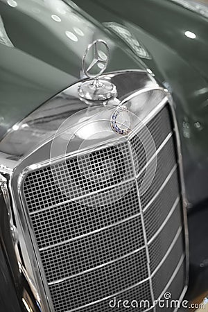 Close up shot of a Mercedes 220S blue car`s 3d logo and grid which produced in 1958. Editorial Shot in Izmir Turkey Editorial Stock Photo