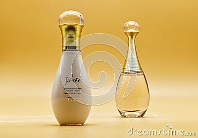 J`adore from Dior perfume and body milk on golden background Editorial Stock Photo