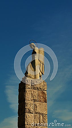 Lone angel sculpture made of stone Stock Photo