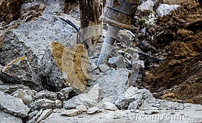 A Jack Hammer Crushes Concrete Stock Photo