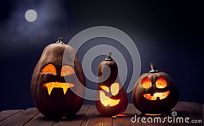 Jack o lanterns Halloween pumpkin face on wooden background Stock Photo