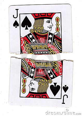 A jack of spades playing card torn in half. Stock Photo
