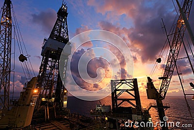 Jack Up Oil Drilling Rig At Sun Rise Time Stock Photo