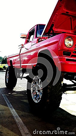Jacked up run over big red Stock Photo