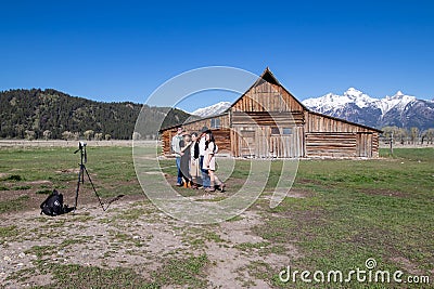 Jackson Hole, Wyoming, USA, May, 29, 20021: Tourist taking a family portrait next to the T.A. Moultan Barn in the Grand Teton Editorial Stock Photo