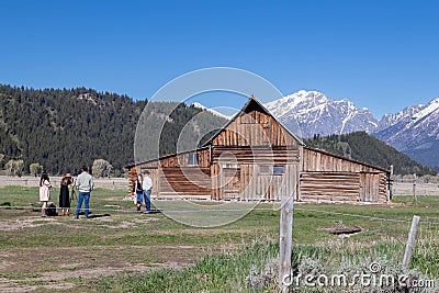 Jackson Hole, Wyoming, USA, May, 29, 20021: Tourist taking a family portrait next to the T.A. Moultan Barn in the Grand Teton Editorial Stock Photo