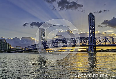 JACKSONVILLE, FLORIDA MAIN ST BRIDGE AT SUNSET WITH GOD RAYS Stock Photo