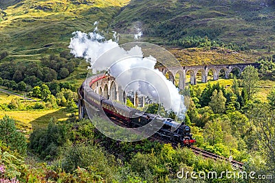 Jacobite steam train on Glenfinnan viaduct in Scotland, United Kingdom Editorial Stock Photo