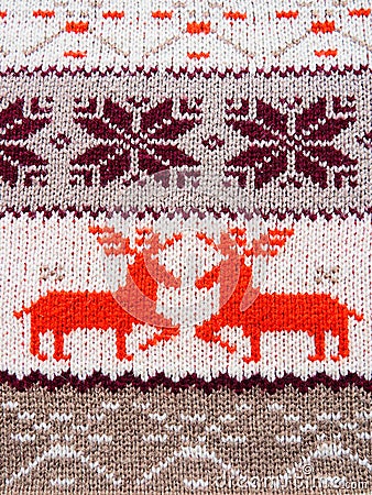 Jacquard knitted pattern. Geometric ornament for Christmas or New Year. Two red deer on a white knitted background Stock Photo