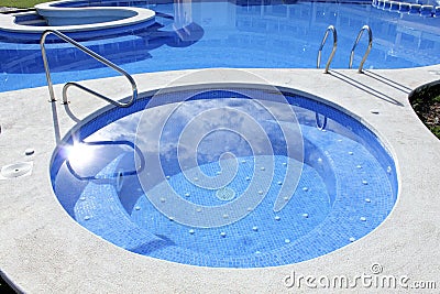 Jacuzzi outdoor blue swimming pool Stock Photo