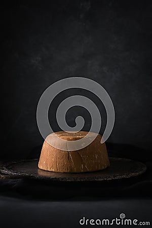 Jaggery, cup shaped unrefined sugar or palm sugar on plate Stock Photo