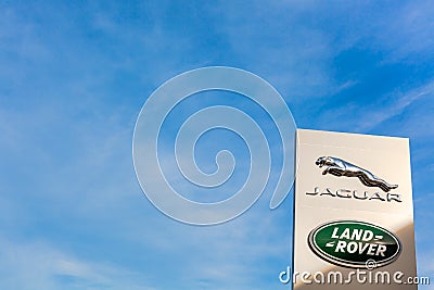 Jaguar Land Rover brand logo blue sky background Editorial Stock Photo