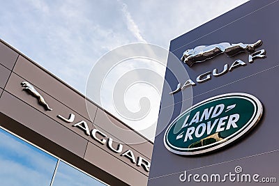 Jaguar Land Rover brand logo blue sky background Editorial Stock Photo